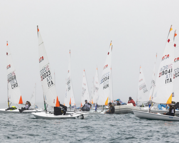 Youth racing dinghies on the ocean